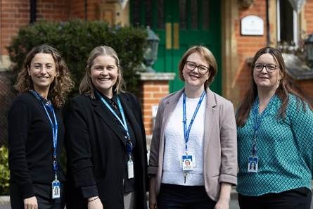 A group of women wearing lanyards
AI-generated content may be incorrect.